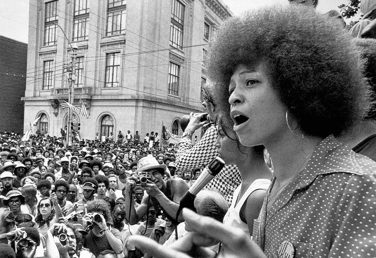 photograph of Angela Davis speaking at a political rally in Raleigh, NC in 1974