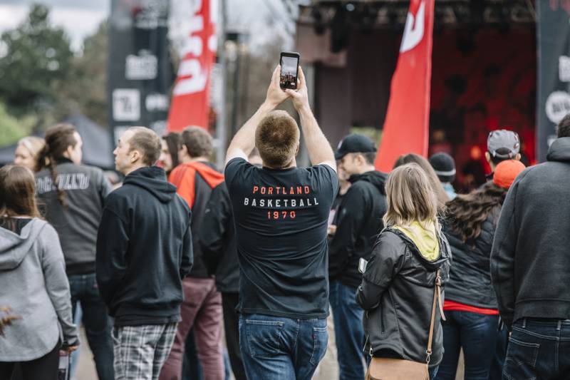 A Trail Blazers fan snaps a cellphone photo in the Rose Quarter during the 2019 playoffs.