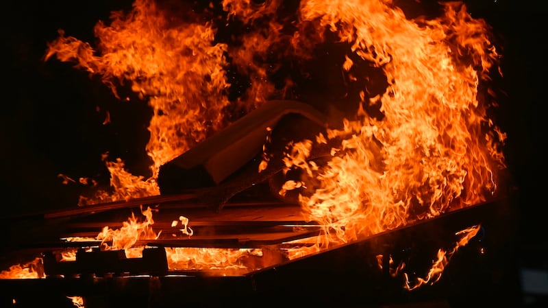 A dumpster fire burns in downtown Portland