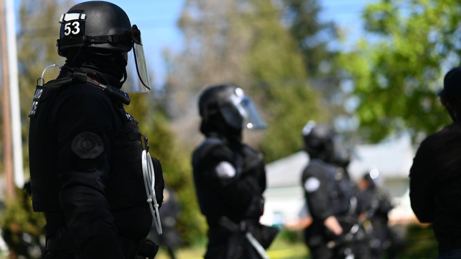 Police officers in riot gear.