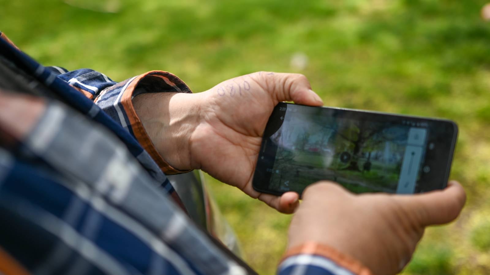 David Hernandez shows WW reporters a video of police shooting Robert Delgado in Lents Park.